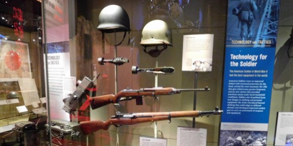 M1 Garand rifle (bottom), M1 carbine, and M1 steel helmet and liner, worn by soldiers from World War II through Vietnam.